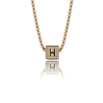 Lifestyle photo of Iced Cube Initial Necklace as meaningful love gift