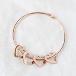 Close-up detail of Bracelet with customizable heart pendants showing premium quality craftsmanship