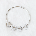 Lifestyle photo of Bracelet with customizable heart pendants as meaningful love gift