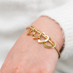 Bracelet with customizable heart pendants custom engraving detail and material quality